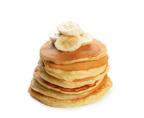 Tasty pancakes with banana slices isolated on white