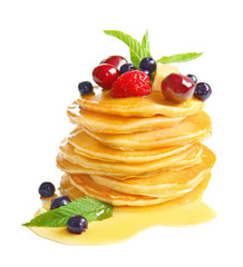 Tasty pancakes with honey and berries on white background