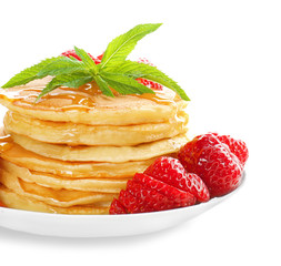 Plate with tasty pancakes and strawberry on white background