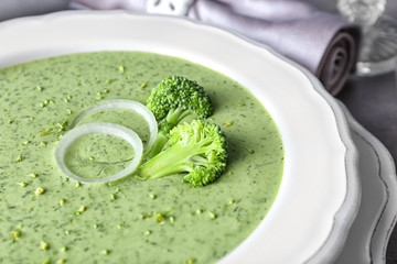 Plate with delicious broccoli cheese soup, closeup