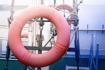 Red lifebuoy. Is on the ship.