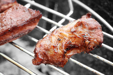 Cooking of appetizing juicy spare ribs outdoors