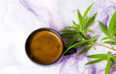 Obraz na płótnie Canvas Coffee with marijuana leaf top view