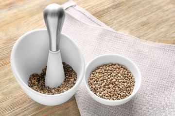 Composition with hemp seeds on wooden background