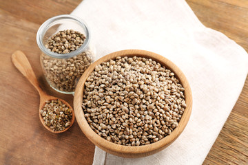 Composition with hemp seeds on wooden background