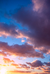 Clouds-lambs on a blue sky during a beautiful sunset.