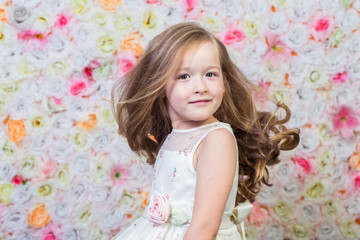 Portrait of little girl on floral background