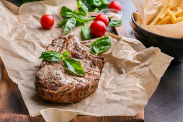 Delicious grilled steak frites on waxed paper