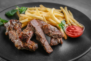 Delicious steak frites on plate, closeup