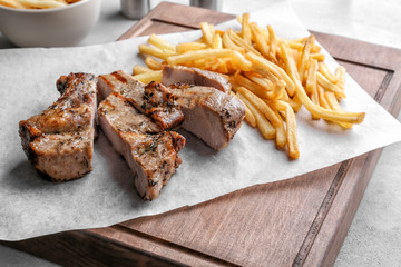 Delicious grilled steak frites on waxed paper