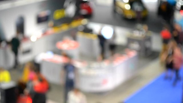 Abstract Defocused Blurred Background flow of many people inside space shopping center or mall, exhibition, exposition, hall real time.