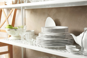 Tableware on shelf indoors