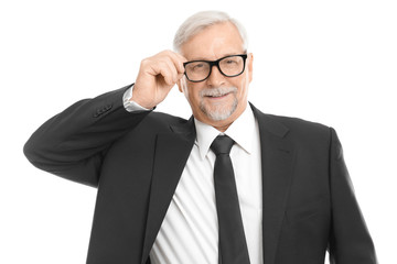 Elderly man in black suit on white background