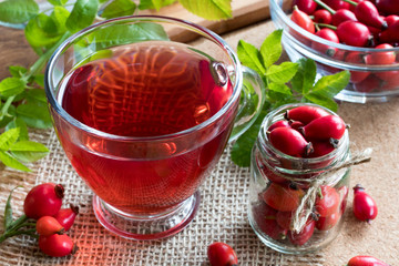 A cup of rose hip tea on a table