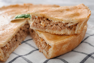 Delicious meat pie on table