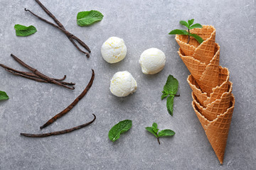 Composition with yummy vanilla ice cream on grey background