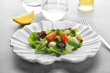 Delicious vegetable salad on table