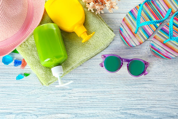 Composition with summer accessories on wooden background