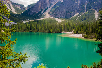 Fototapeta na wymiar Braies lake under Alps with turquoise water 1