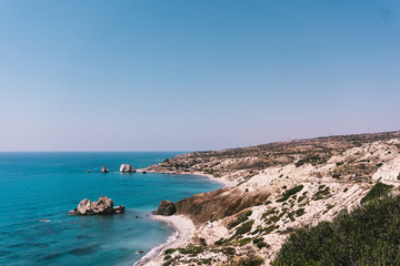 Fototapeta na wymiar Beautiful wild beach with clear turquoise water and rocks. Cyprus.