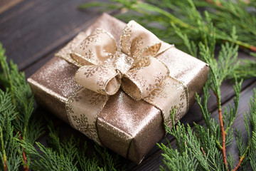 Christmas gift on the antique wooden background.
