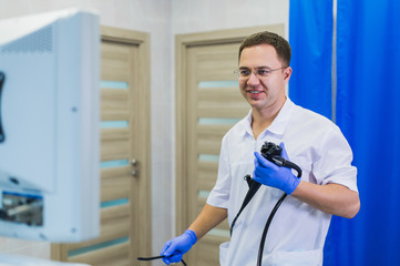proctologist holding anoscope at hospital ward