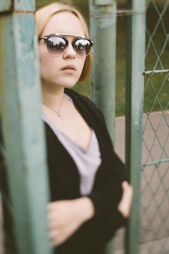 portrait of real young woman with sunglasses