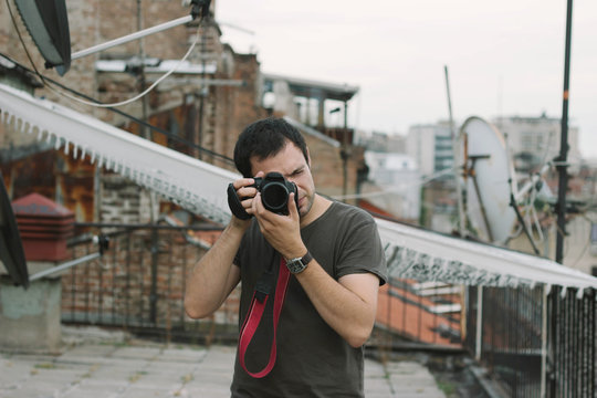 Portrait of a handsome male model with camera