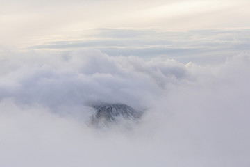 Mountain ridge on the Brecon Beacons, Wales, UK, with low cloud and rising mist