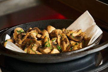 Baked delicious champignons mushrooms