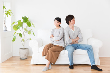 young asian couple in living room