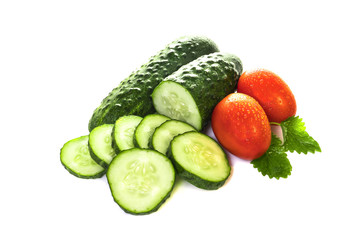 vegetables cucumbers and tomatoes on a white background