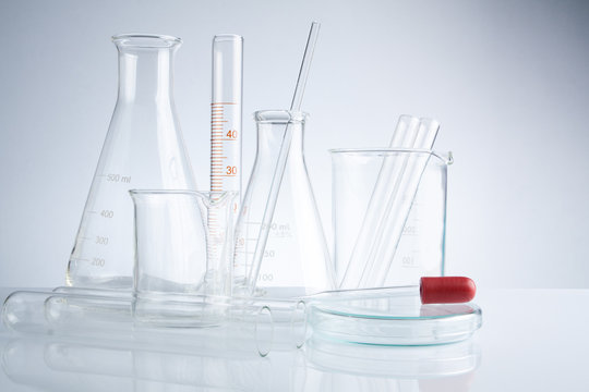 Laboratory glassware on table, Symbolic of science research.