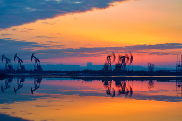 The sunrise of oil field landscape