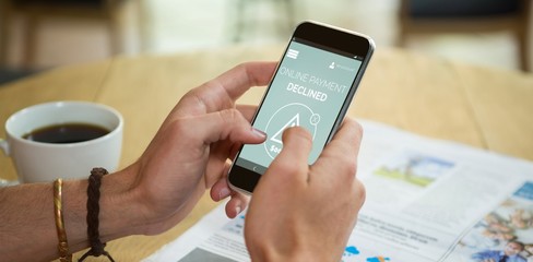 Composite image of online payment text on blue mobile display