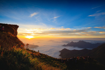 Tourist looking sunrise at Phu Chi Fa in Chiang rai, Thailand