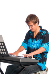 Teenager playing a keyboard