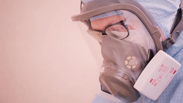 Head of man in modern gas mask - close up. Scientist in goggles,mask close-up. Healthcare and biotechnology concept
