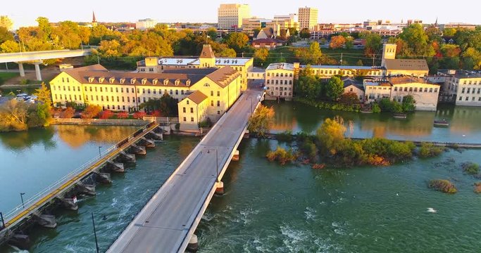 Sunrise time lapse flyover of beautiful Appleton Wisconsin riverfront and downtown in Autumn.