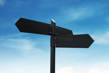 Blank road signpost, on blue sky and white clouds background
