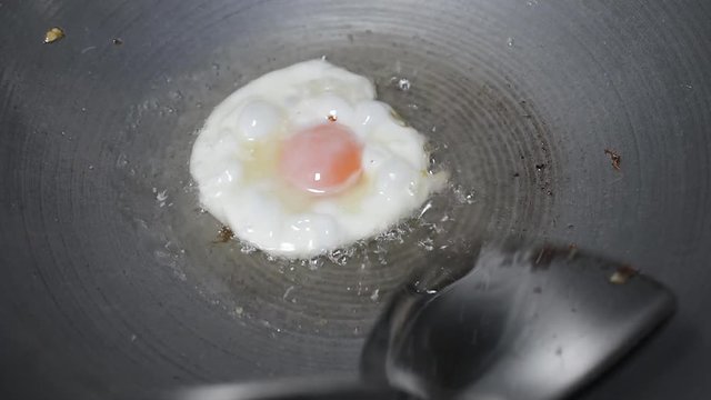 A fried egg with oil on pan./It's breakfast in fewer than five minutes. It's some extra oomph for your salad. It's what turns a bowl of rice and leftover veggies into a legit dinner. In my kitchen,