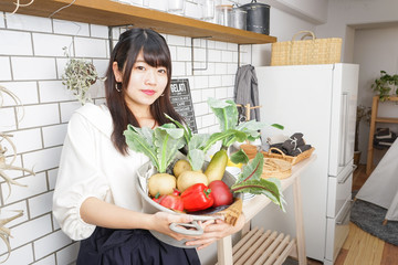 young woman holding vegetables 