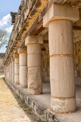 massive stone columns at Uxmal mayan archeological site