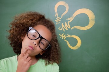 Composite image of cute pupil thinking