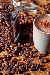 Aroma coffee chocolate cookies and spices on the wooden table. Dark wooden background. Top view. Close. Closeup.