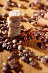 Aroma coffee chocolate cookies and spices on the wooden table. Dark wooden background. Top view. Close. Closeup.