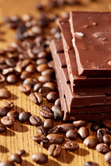 Aroma coffee chocolate cookies and spices on the wooden table. Dark wooden background. Top view. Close. Closeup.