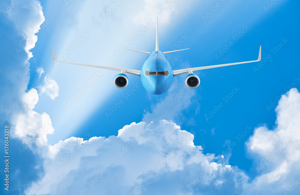 Leinwandbilder Airplane flying in the blue sky among clouds and sunlight