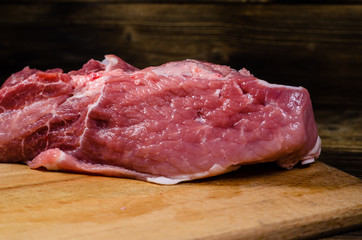 Raw pork meat on cutting board