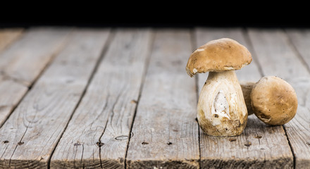 Wooden table with some fresh Porcinis (selective focus)